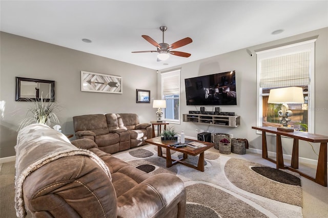 living room with ceiling fan and carpet floors