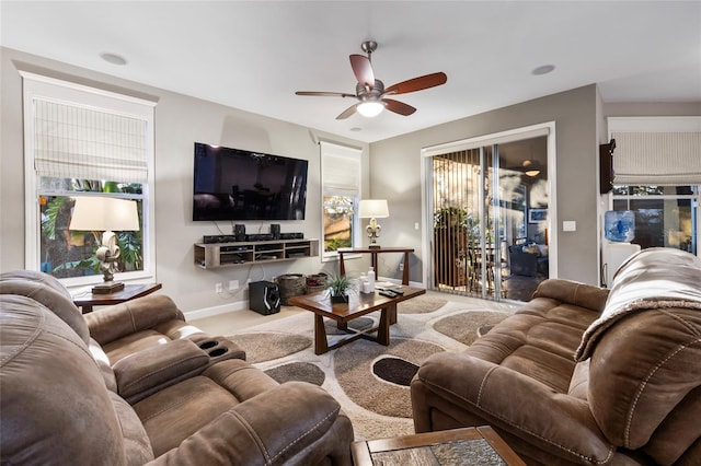 living room with a wealth of natural light and ceiling fan