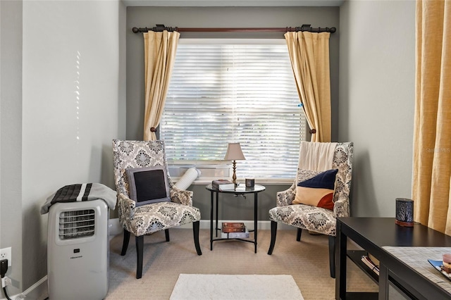 living area featuring light colored carpet