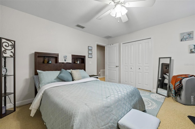 bedroom featuring light carpet, a closet, and ceiling fan