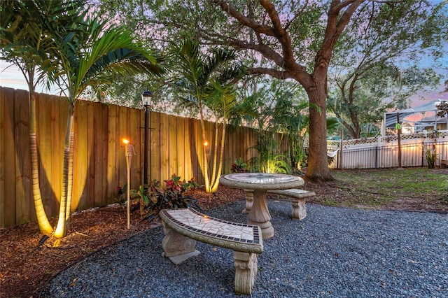 view of yard at dusk