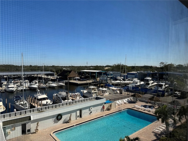 view of pool with a water view