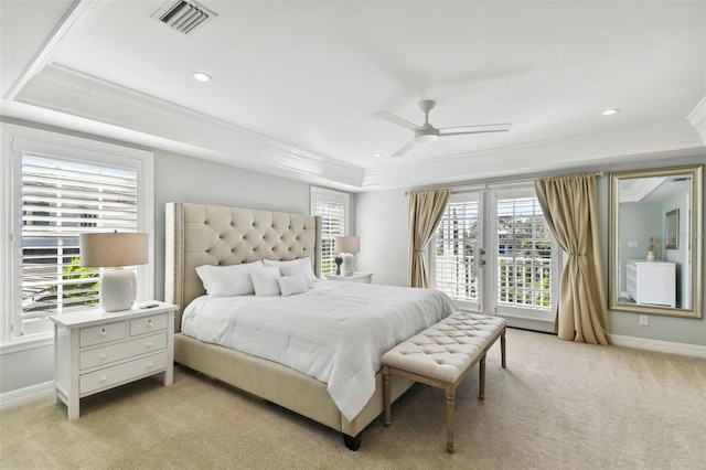 bedroom with multiple windows, light carpet, and ceiling fan