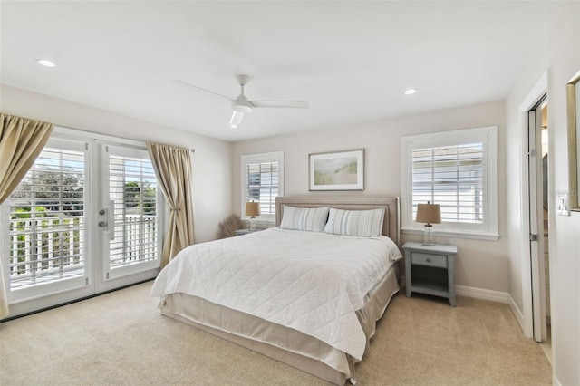 carpeted bedroom with ceiling fan, access to exterior, french doors, and multiple windows