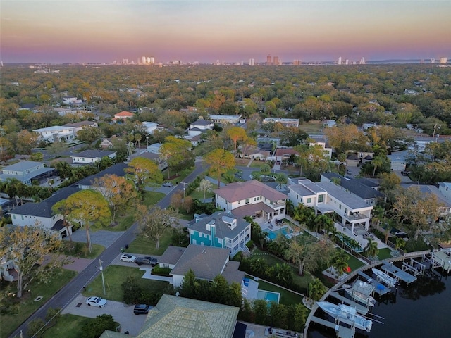 aerial view at dusk with a water view