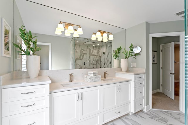 bathroom with visible vents, a sink, a marble finish shower, and double vanity