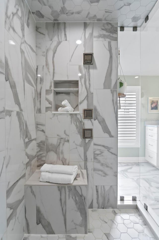 details featuring a marble finish shower