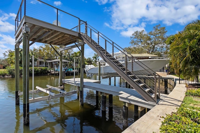 view of dock with a water view and boat lift