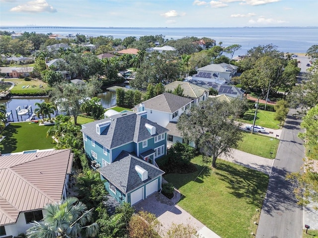 birds eye view of property featuring a water view and a residential view