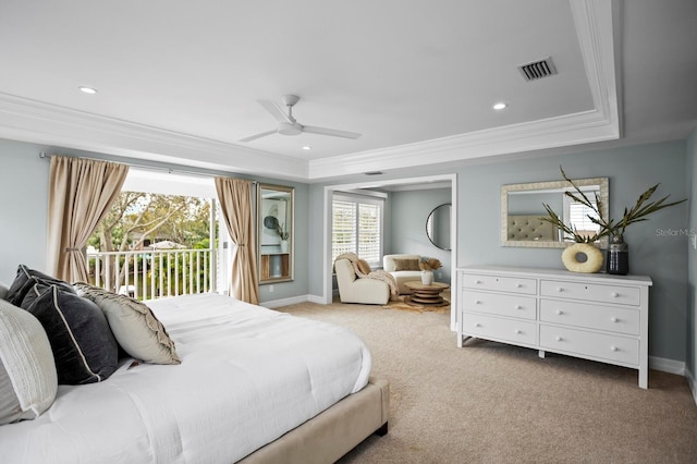 bedroom featuring light carpet, visible vents, access to outside, a raised ceiling, and crown molding