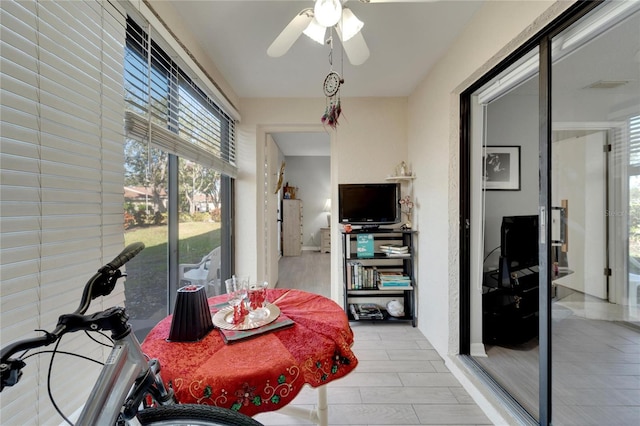 dining area with ceiling fan and light hardwood / wood-style flooring