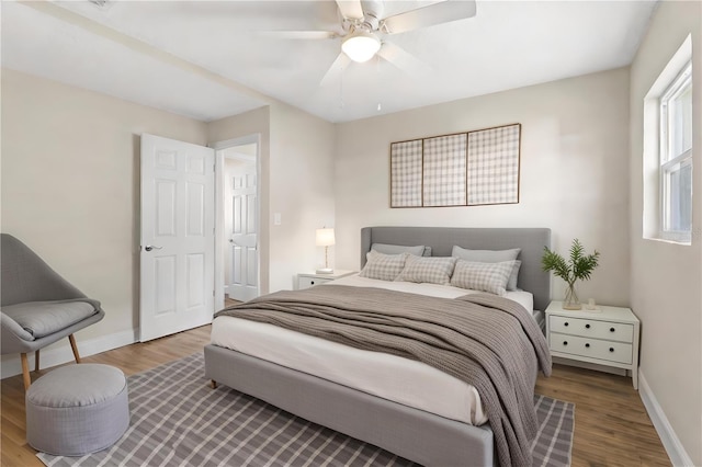 bedroom with ceiling fan and hardwood / wood-style floors