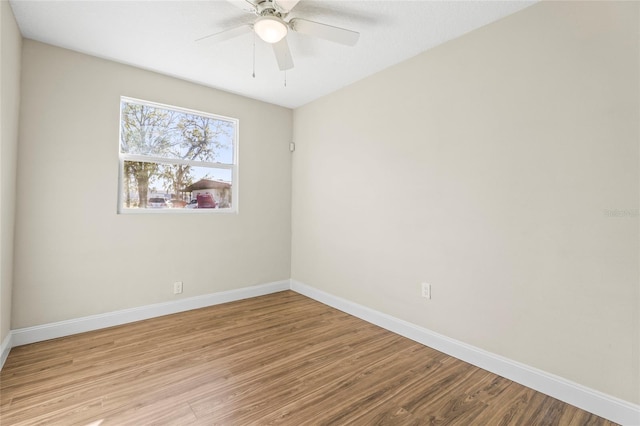 spare room with ceiling fan and light hardwood / wood-style flooring