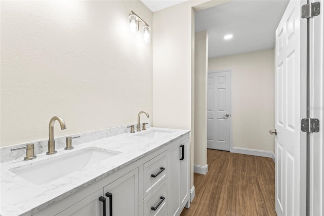 bathroom featuring vanity and hardwood / wood-style flooring