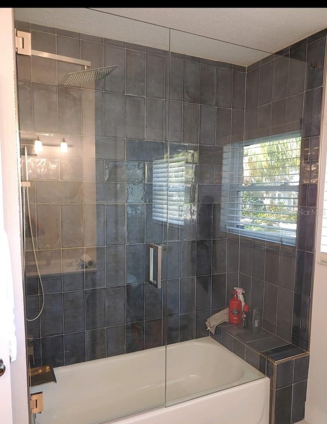 full bath with bath / shower combo with glass door