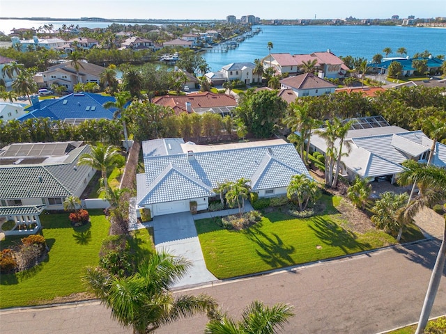 birds eye view of property featuring a water view