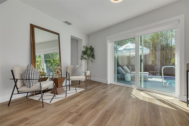 living area with light hardwood / wood-style floors