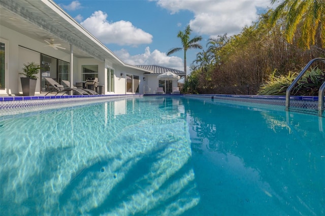 view of swimming pool with a patio