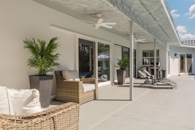 view of patio featuring ceiling fan