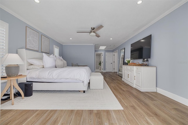 bedroom with light hardwood / wood-style floors, ceiling fan, and crown molding