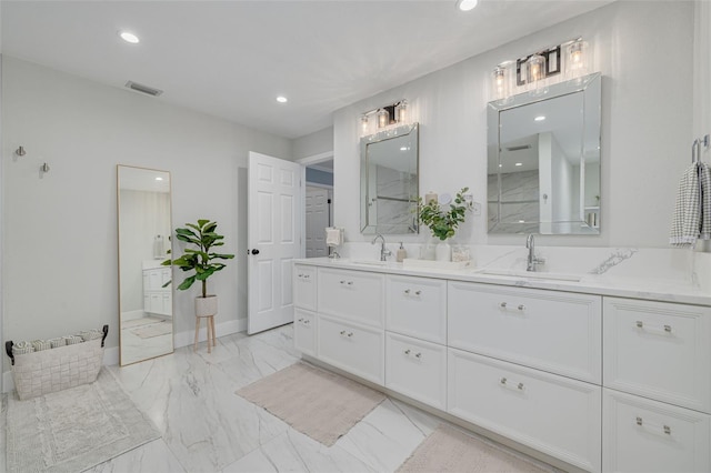 bathroom with a shower and vanity