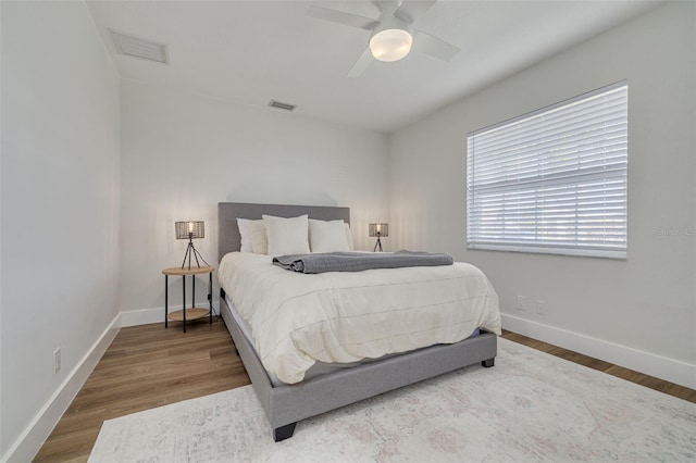 bedroom featuring wood-type flooring and ceiling fan