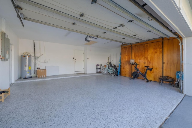 garage with electric water heater, electric panel, and a garage door opener