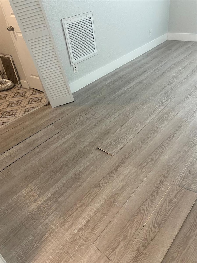 interior details featuring wood-type flooring