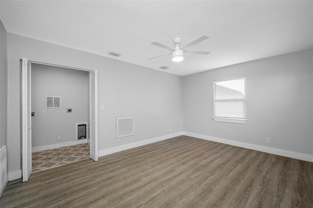 unfurnished room featuring ceiling fan and wood-type flooring