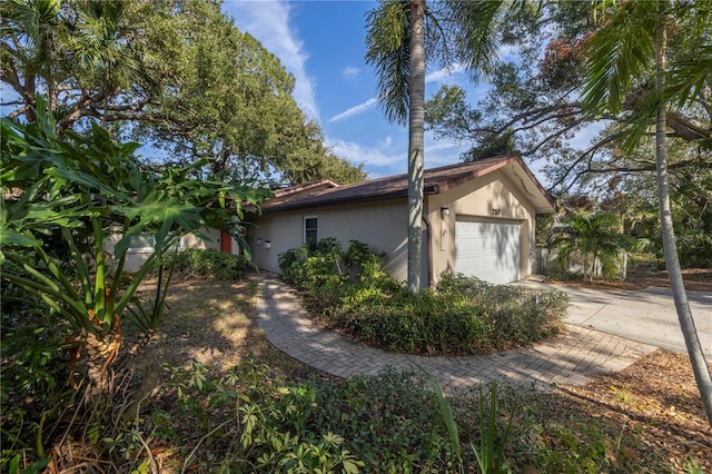 view of property exterior featuring a garage