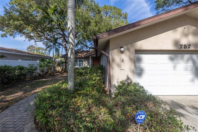 view of side of property featuring a garage