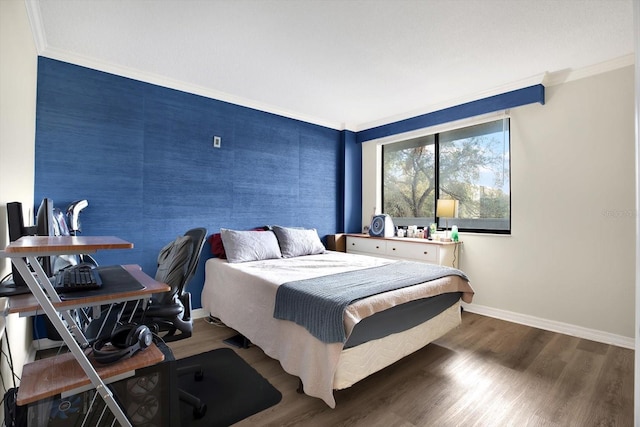 bedroom featuring dark wood-type flooring and ornamental molding