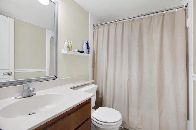 bathroom with vanity, a shower with curtain, and toilet