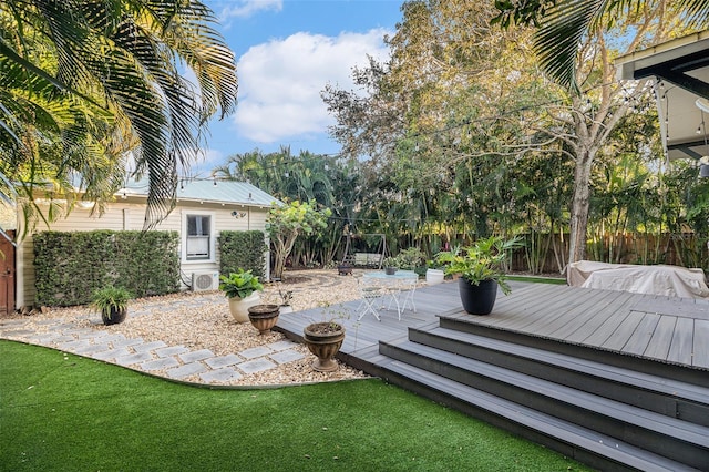 view of yard with a wooden deck and a patio area