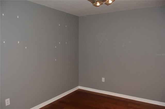 spare room featuring hardwood / wood-style flooring