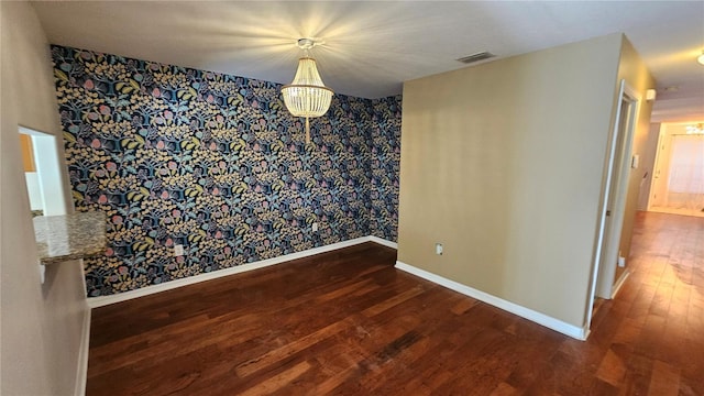 unfurnished dining area with dark wood-type flooring