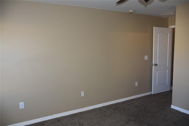 unfurnished room featuring ceiling fan and dark colored carpet