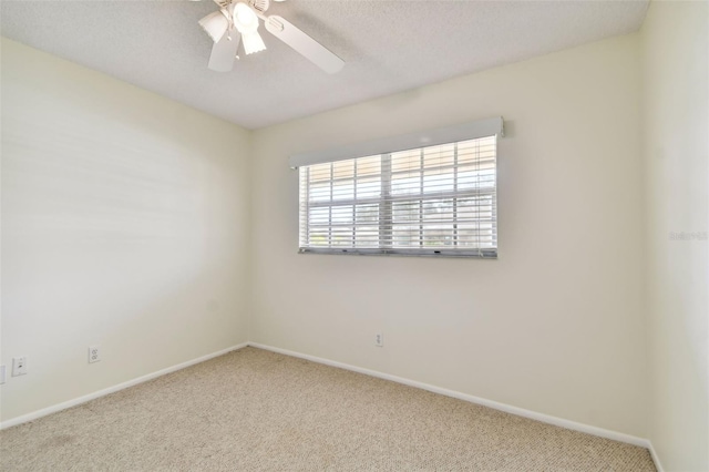 unfurnished room featuring carpet flooring and ceiling fan