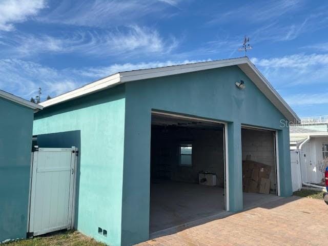 exterior space with an outdoor structure and a garage