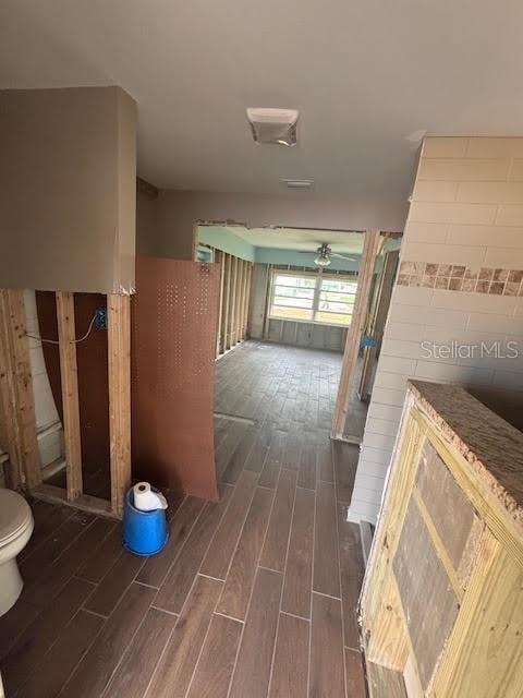 corridor with dark hardwood / wood-style floors