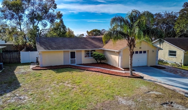 ranch-style house featuring a front lawn and a garage