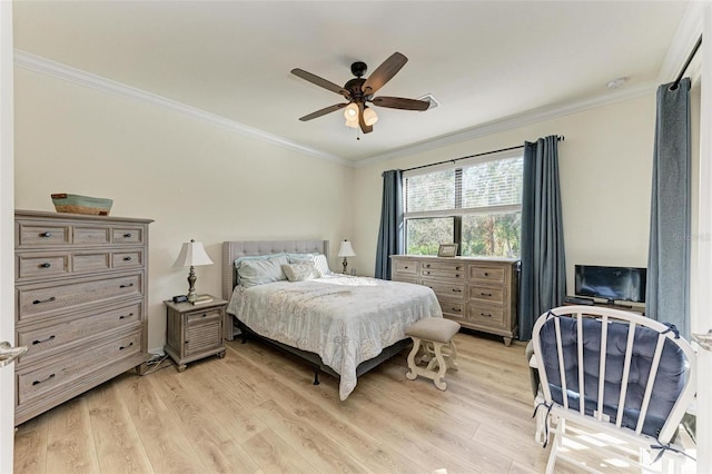 bedroom featuring ceiling fan, light hardwood / wood-style flooring, and ornamental molding