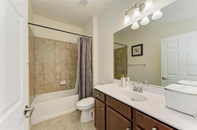 full bathroom featuring tile patterned floors, vanity, toilet, and shower / bath combo with shower curtain