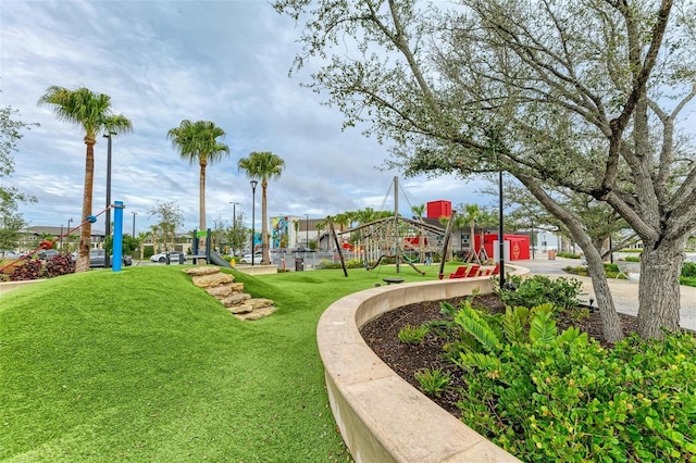 surrounding community with a lawn and a playground