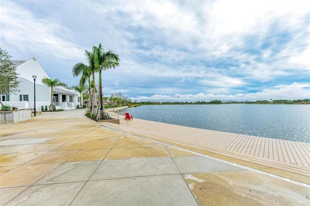 view of patio with a water view