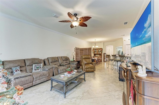 living room with ceiling fan with notable chandelier and crown molding