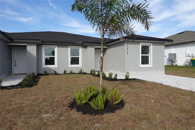 view of side of home with a yard