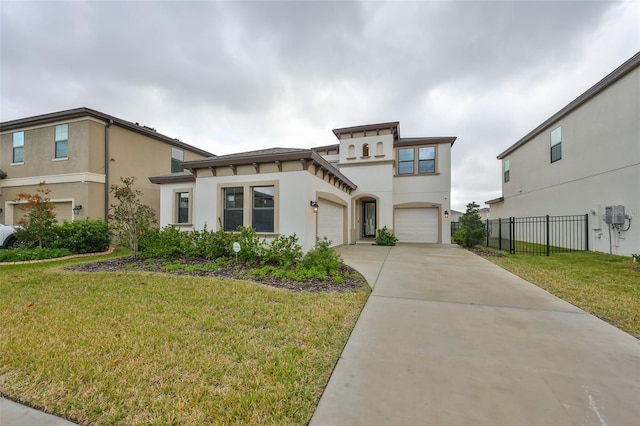 mediterranean / spanish-style home featuring a front yard and a garage