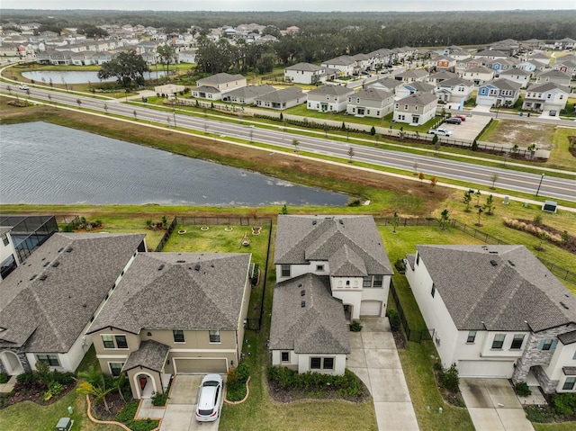 aerial view with a water view and a residential view