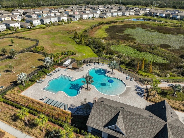 view of swimming pool featuring a patio area and a residential view